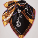 LV Strap And Trunk Square 90 – Black draped view with LV logo and gold trunk details